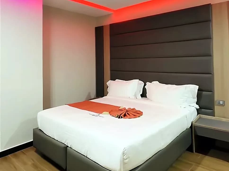 Parents' bedroom with a king bed